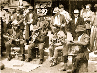 'S T O V E P I P E'&nbsp; W A T S O N's B A N D on Maxwell Street in Chicago, IL, 1948; source: flickr; photographer's name not given